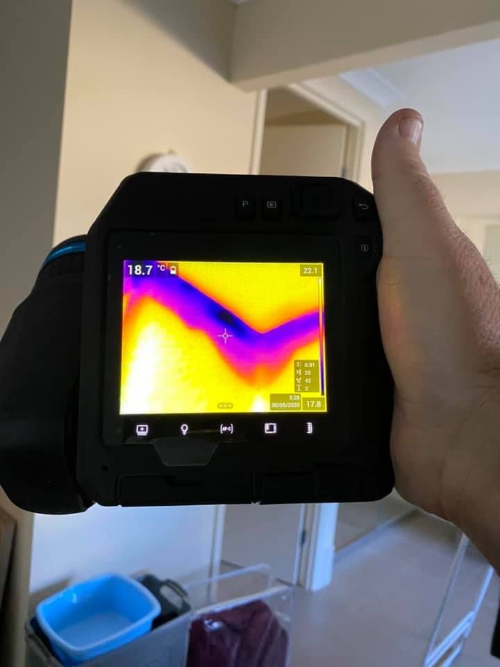 A Person is Holding a Thermal Camera — Restore All Qld in South Burnett, QLD