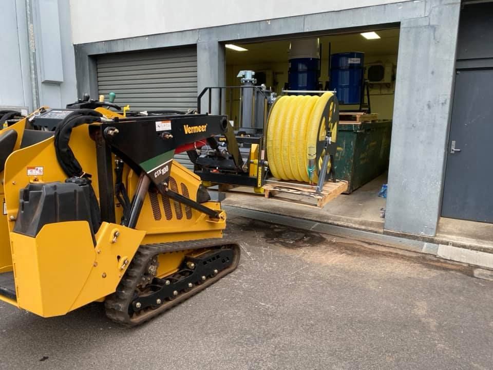 A Garage Door is Being Cleaned — Restore All Qld in Fraser Coast, QLD