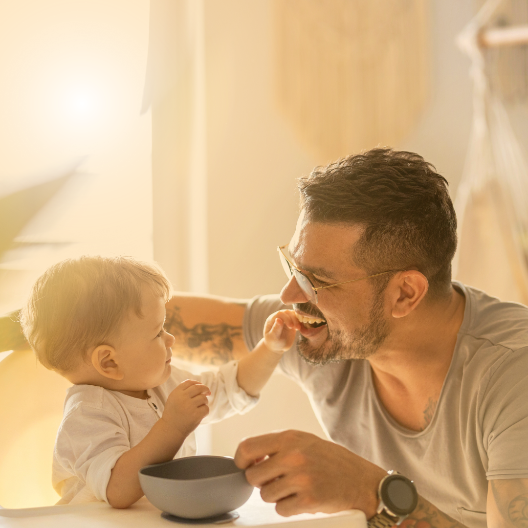 Man laughing with child