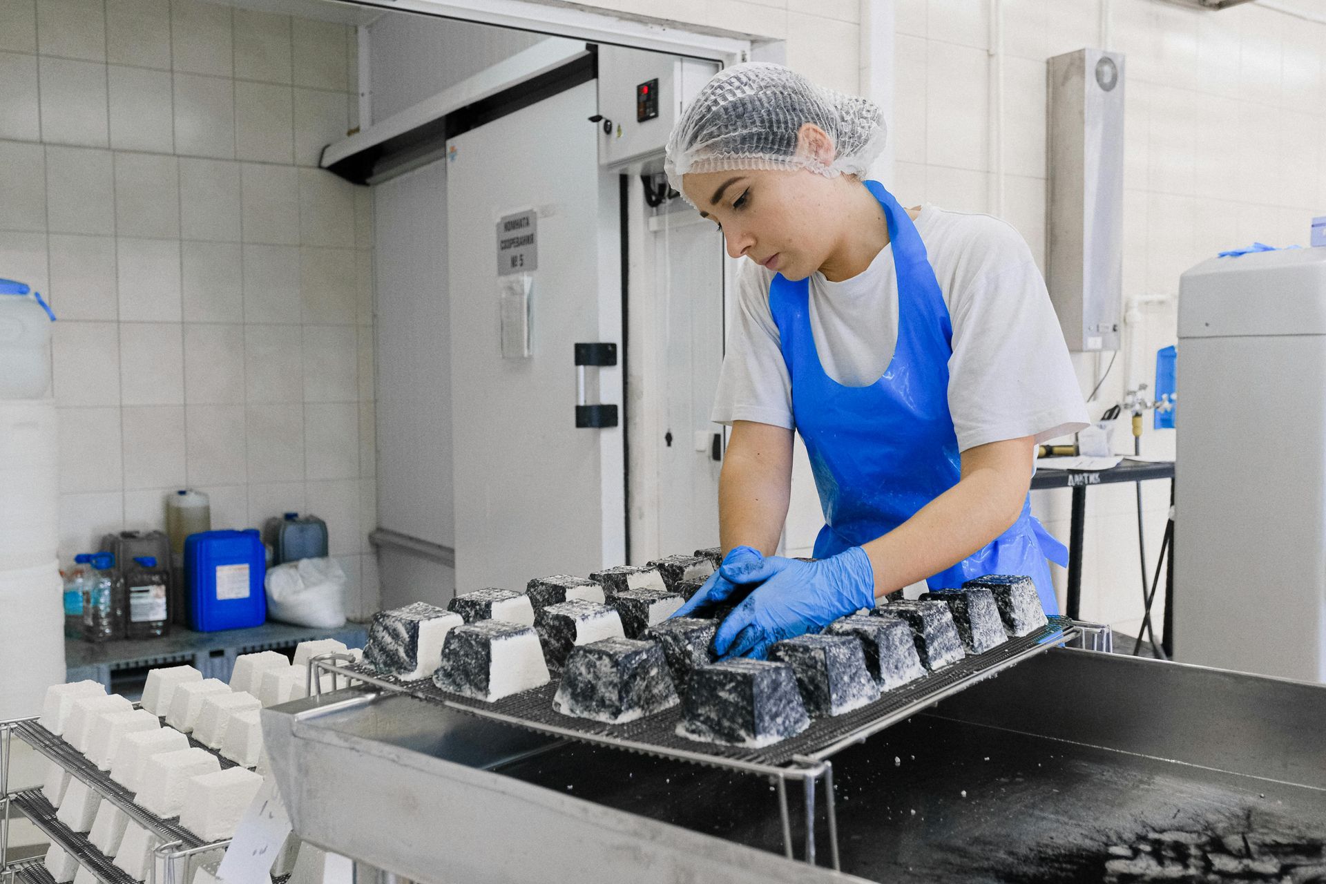 A employee is working in a food factory.