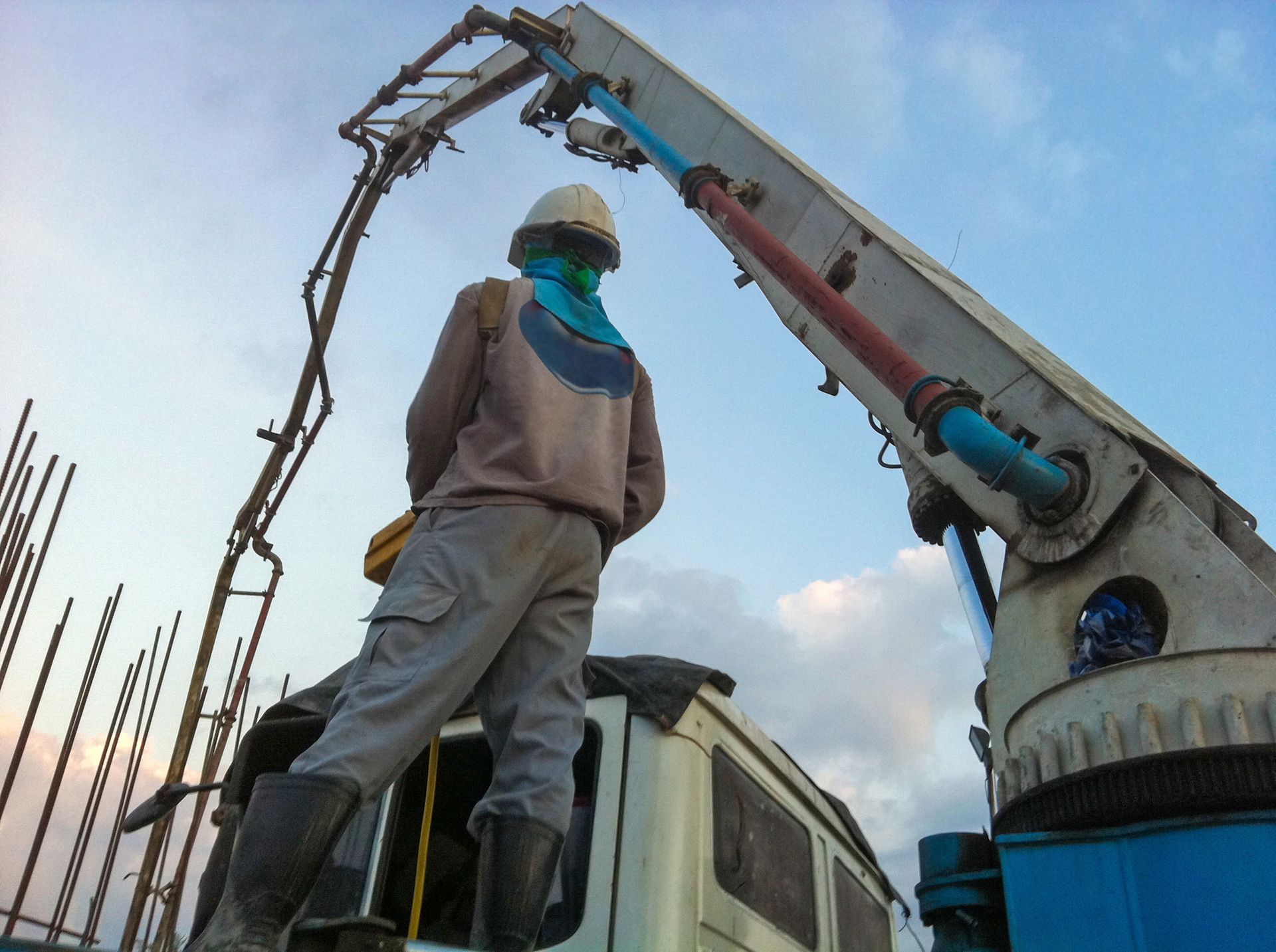 Construction Worker Operating Concrete Pump — Wieland Concreting in Rockhampton, QLD