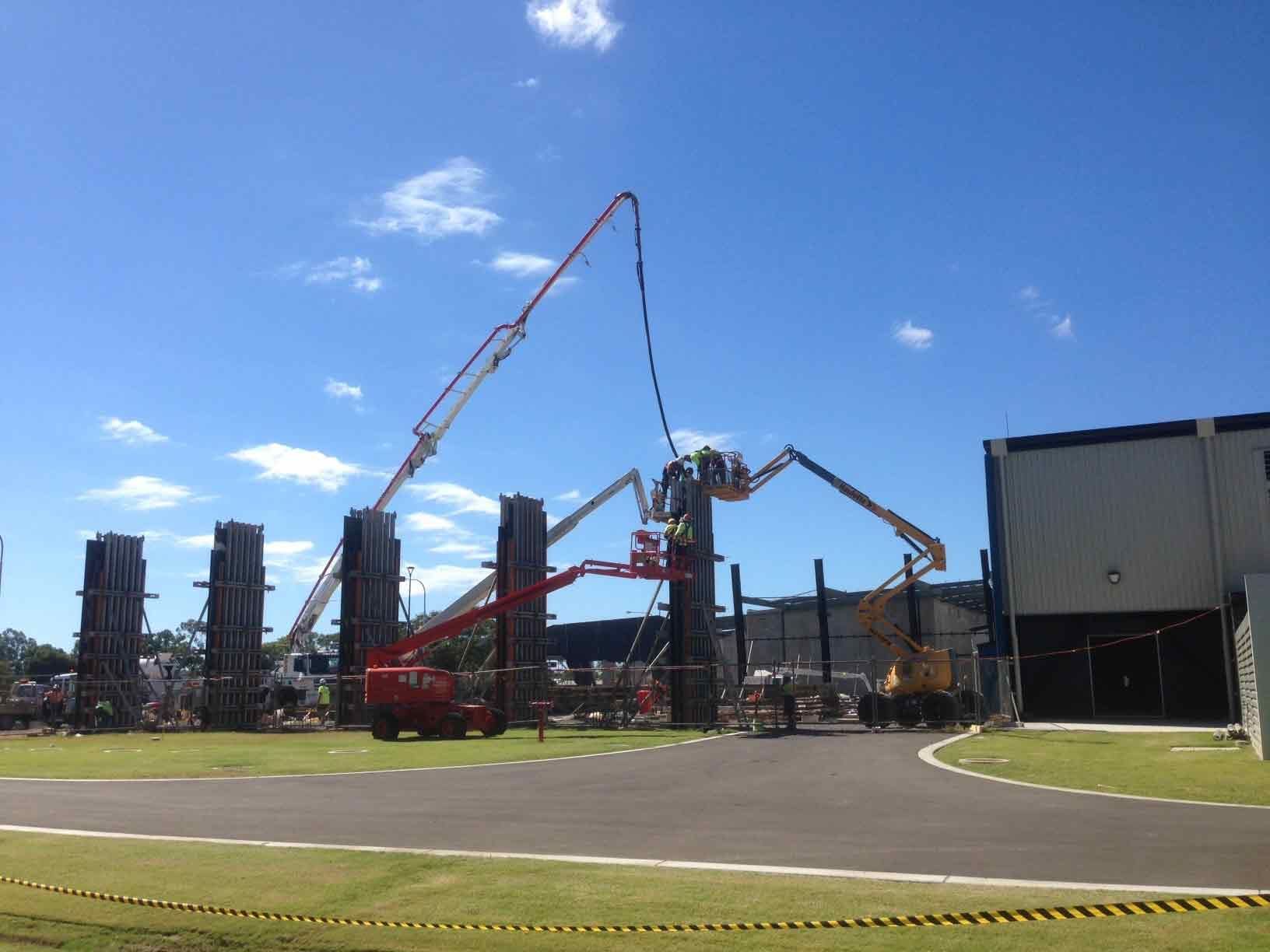 Construction Site with Concrete Pump Trucks Pouring Concrete — Wieland Concreting in Rockhampton, QLD