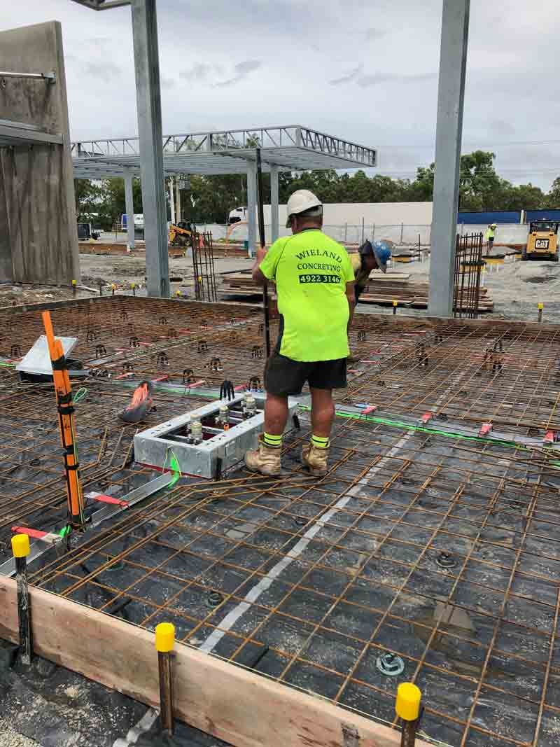 Construction Worker In Neon Shirt — Wieland Concreting in Rockhampton, QLD