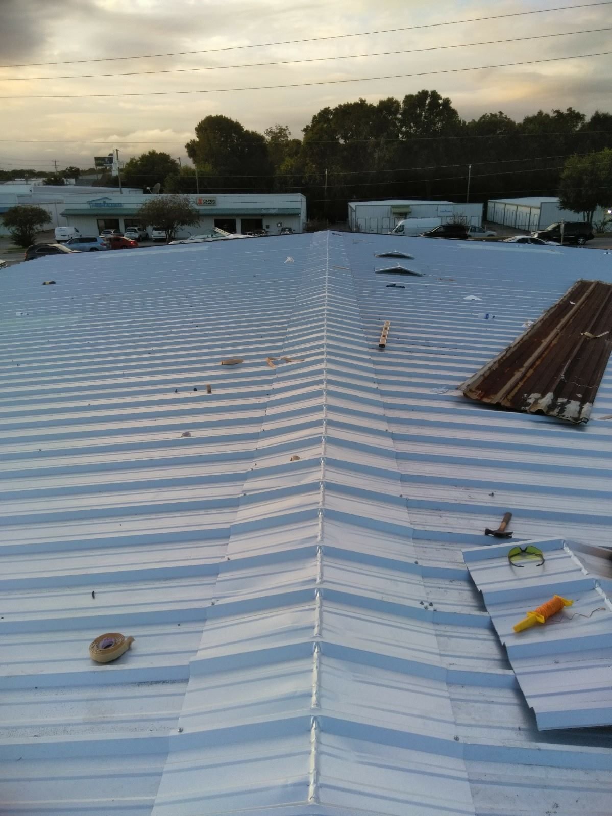 A white roof with a few tools on it