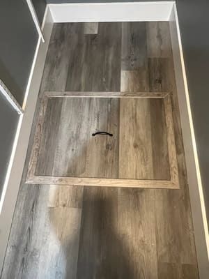 Basement door installation blending into floor