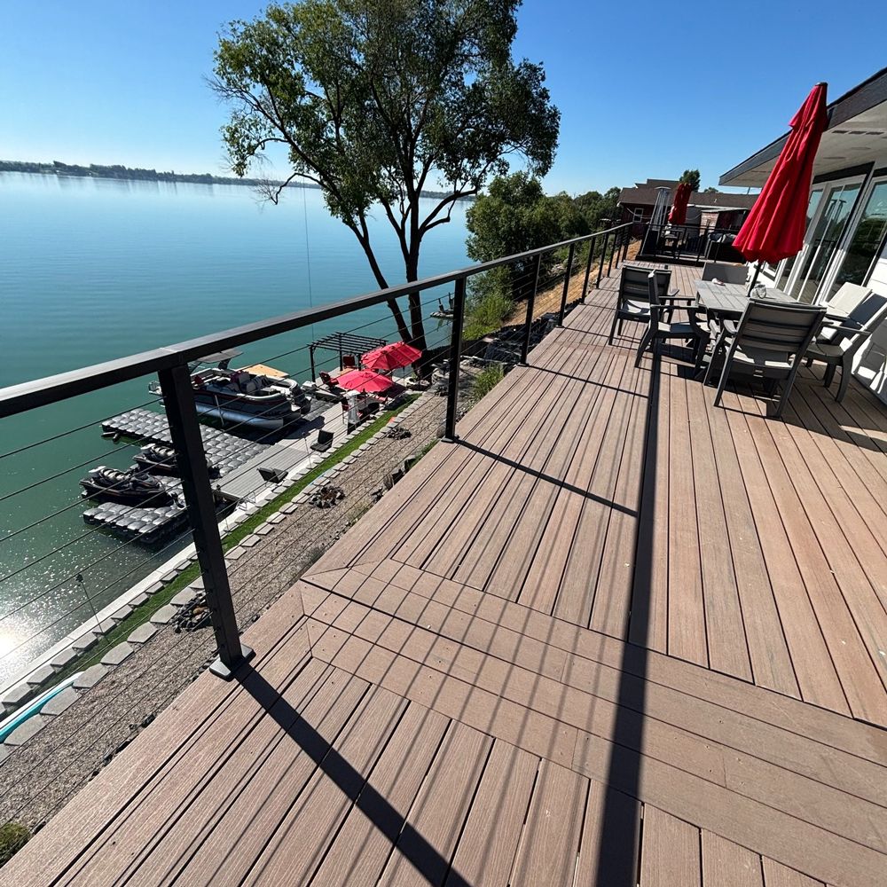 A large deck overlooking a body of water