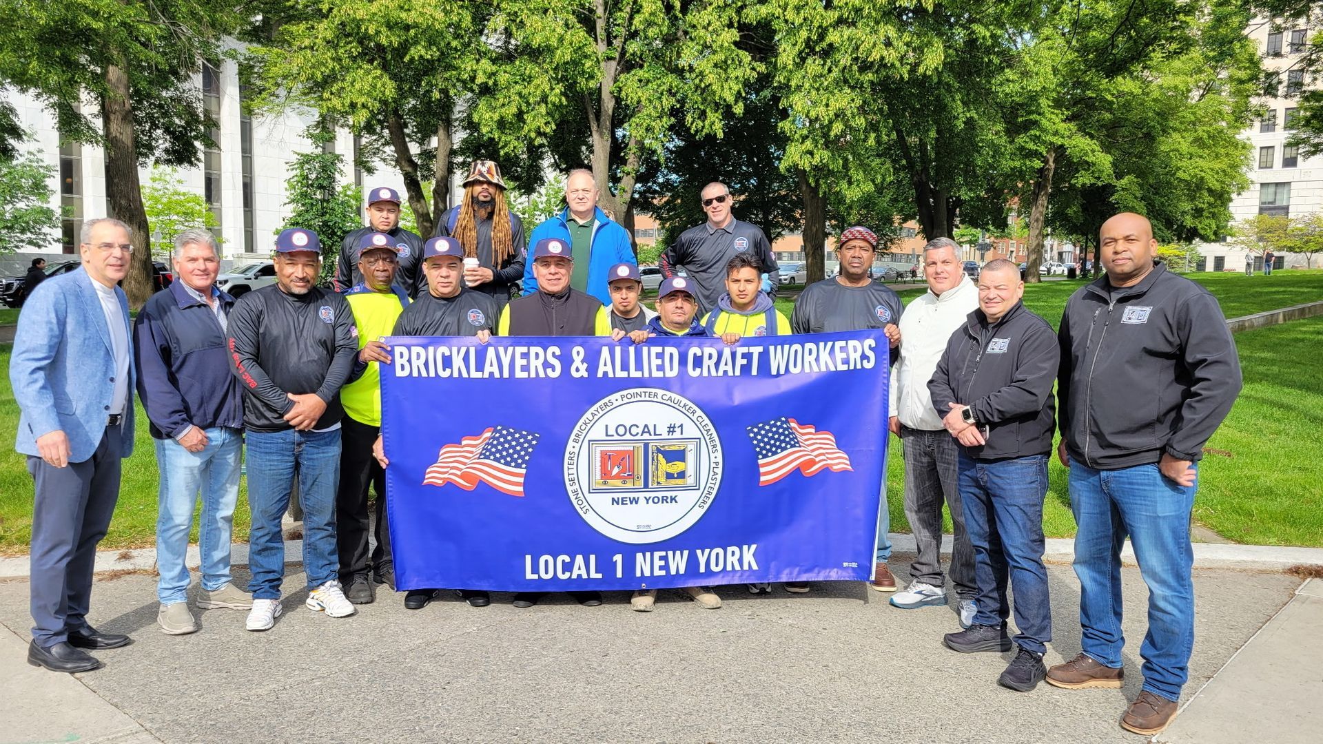 Group of union workers with a banner that reads: 