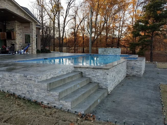 A large swimming pool with stairs leading up to it in Texarkana, TX