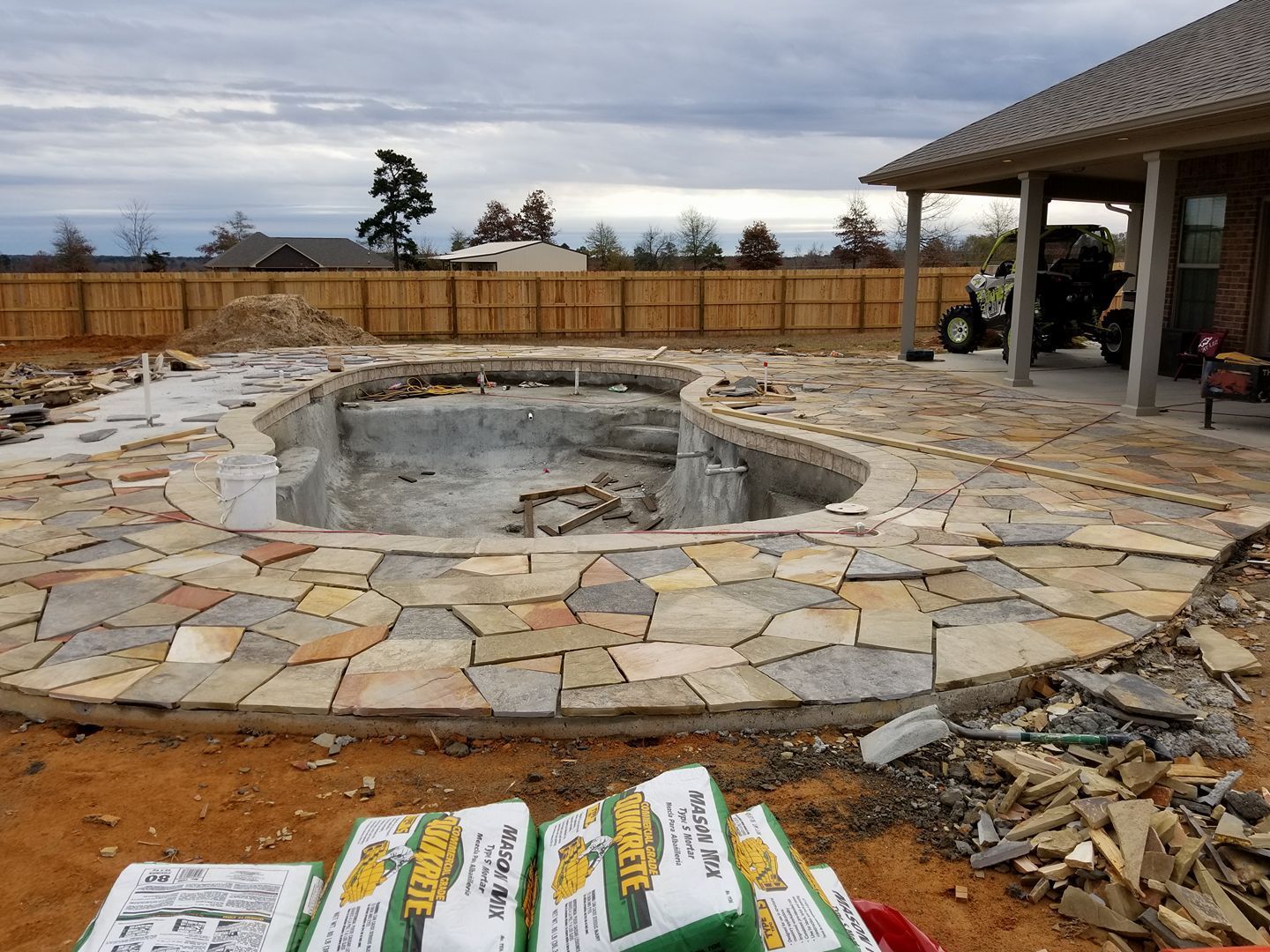 A brick house with a large swimming pool in front of it in Texarkana, TX