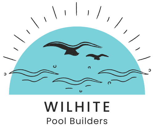 A logo for wilhite pool builders with birds flying over the ocean
