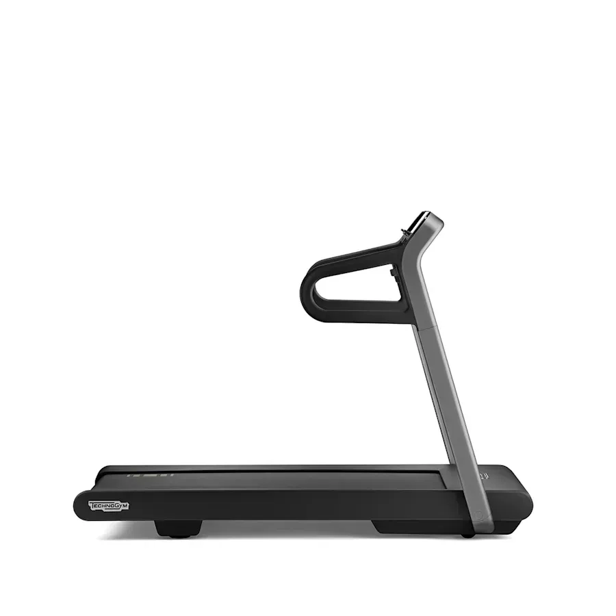 A sleek, black Technogym treadmill seen from the side, isolated against a white background.