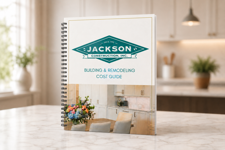 Notebook with “JACKSON” cover on a desk, in a bright modern room