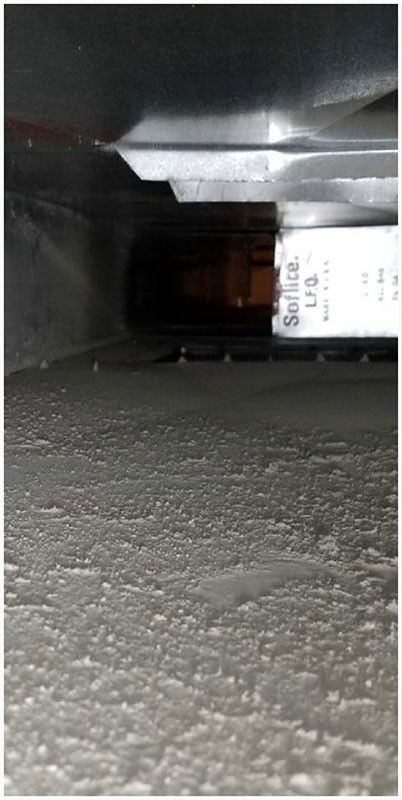 A close up of a concrete floor with a label on it.