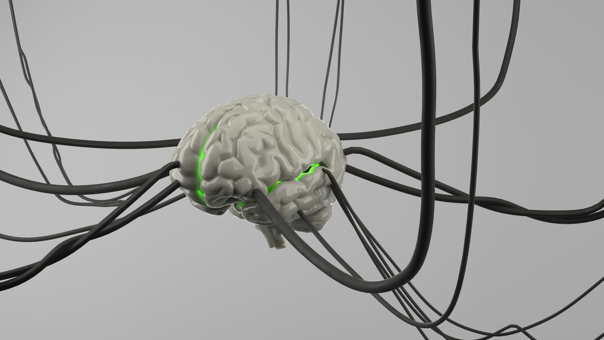Gray brain with glowing green nodes tangled in black cables against a light background