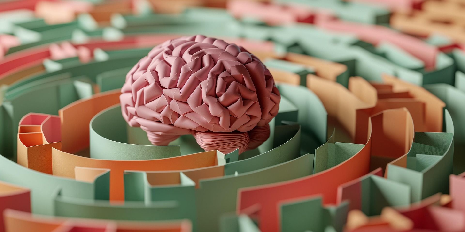 Pink brain model in a maze of green and orange walls, symbolizing problem-solving and decision-making
