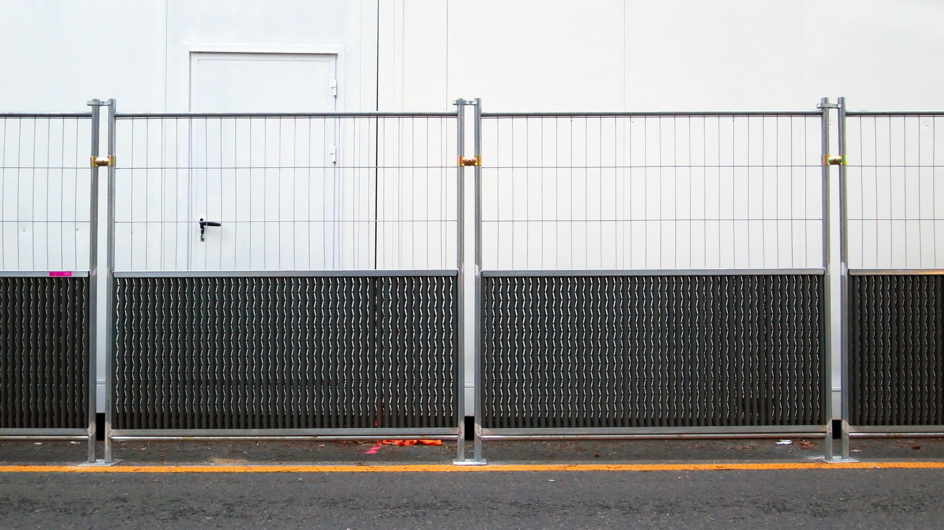 Silver construction site fencing.