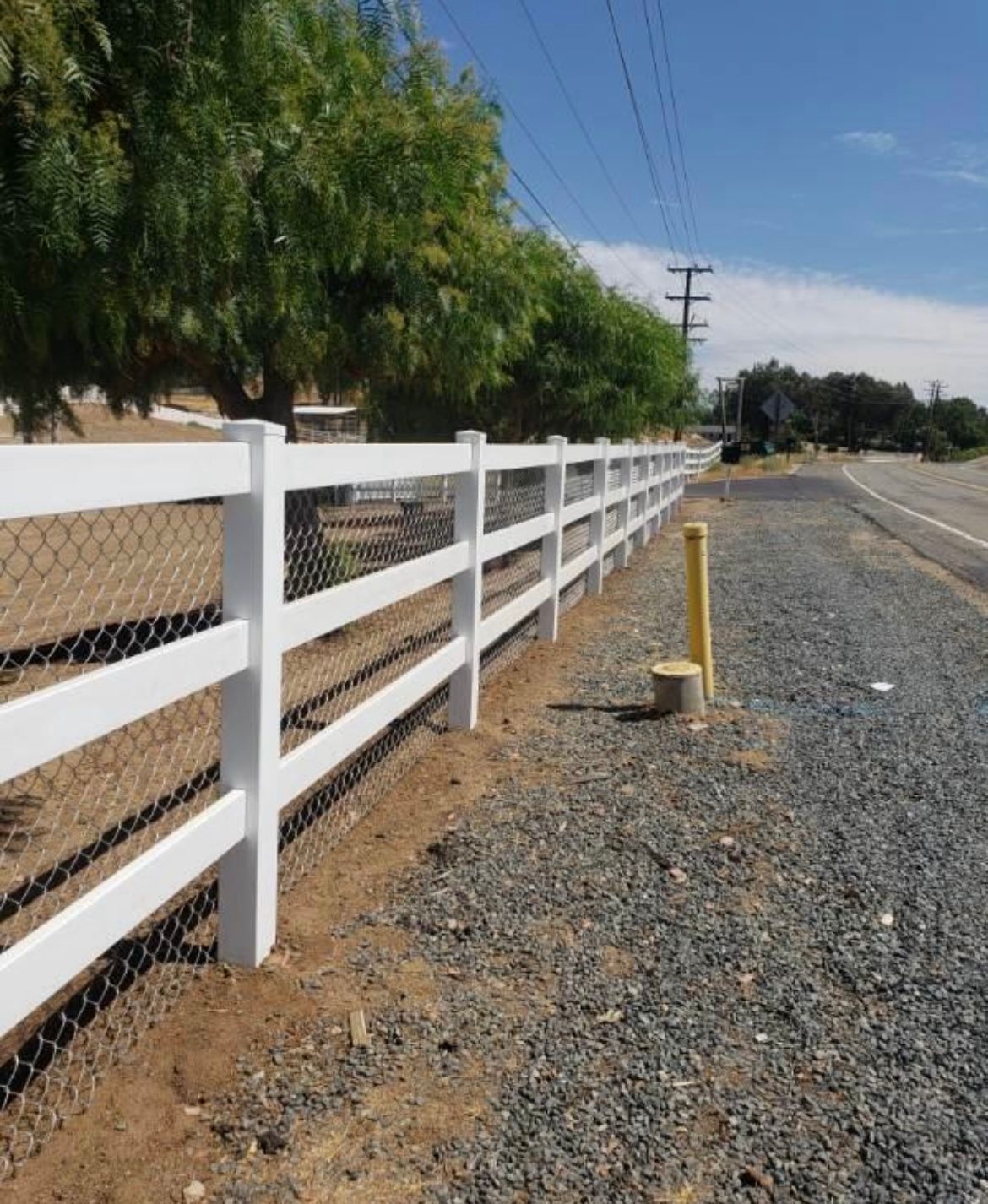 Worker measuring fence