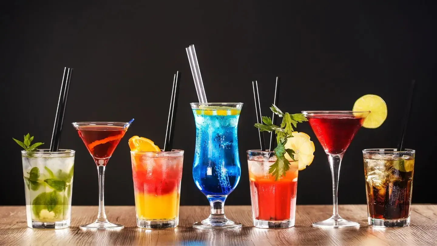 There are many different types of cocktails on the table.