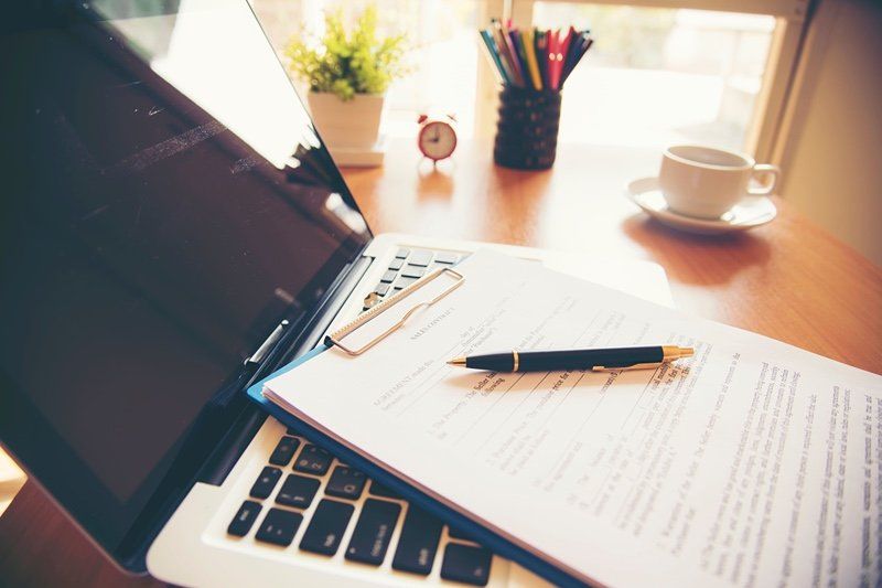 laptop, coffee and other items you'd need to calculate expenses