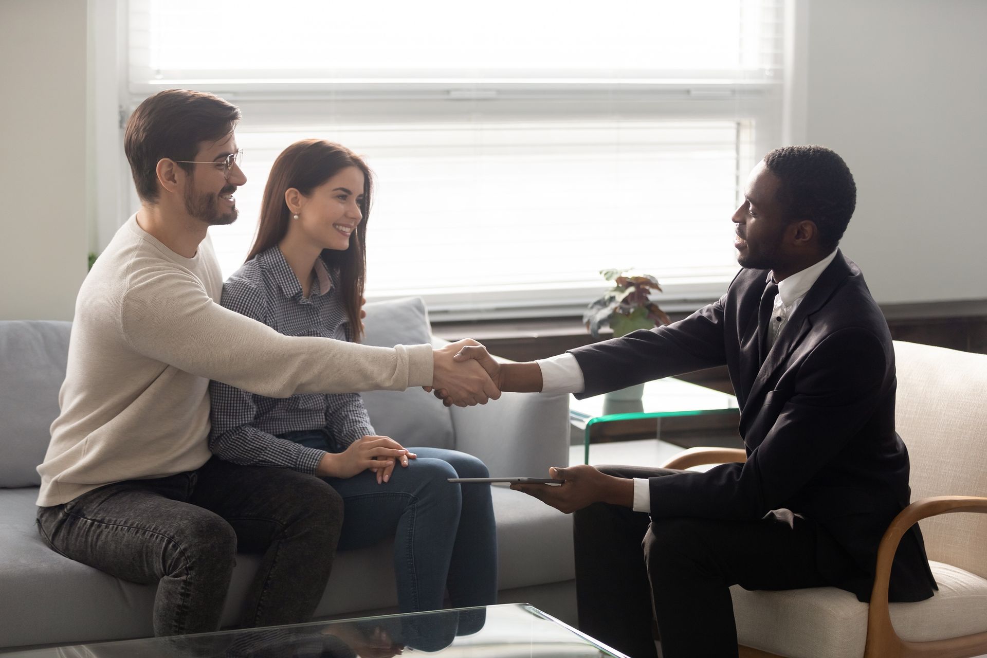 property manager shaking hands with new clients