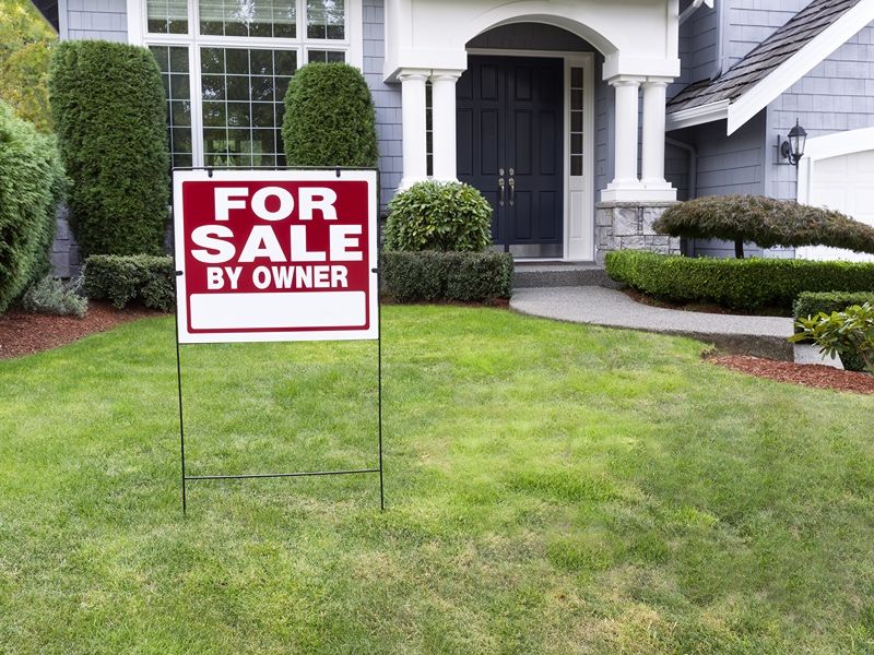 for sale sign in someones home