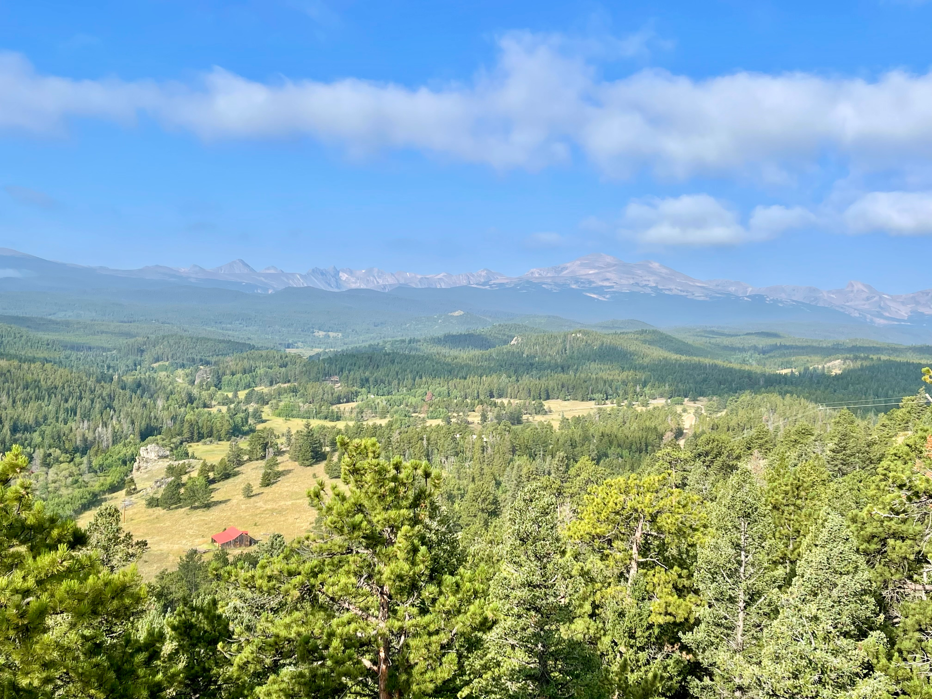 mountains and a cabin and trees