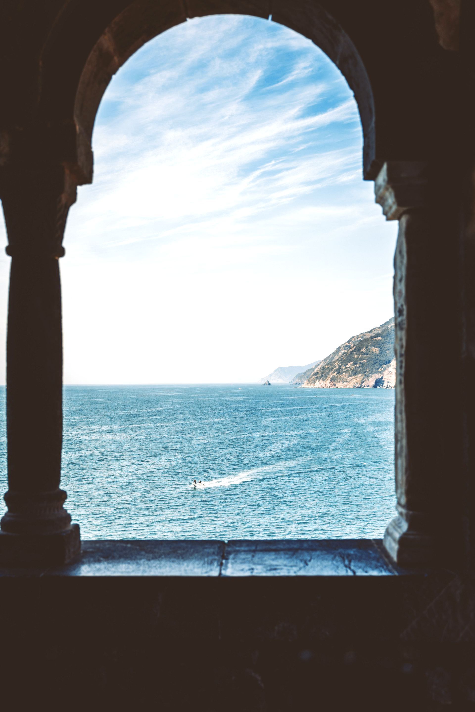 blue water being seen through a monument