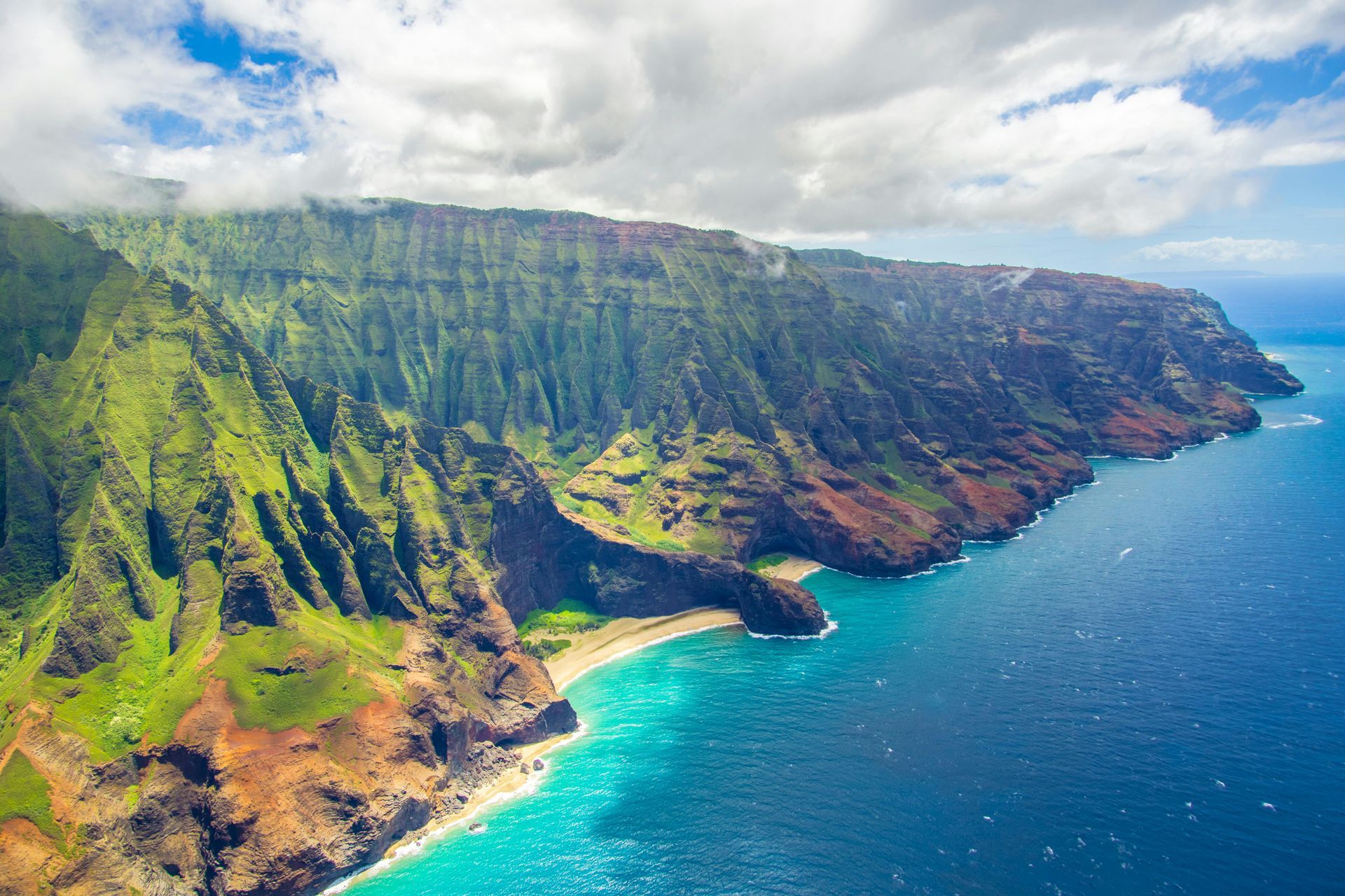 an ocean and mountain landscape