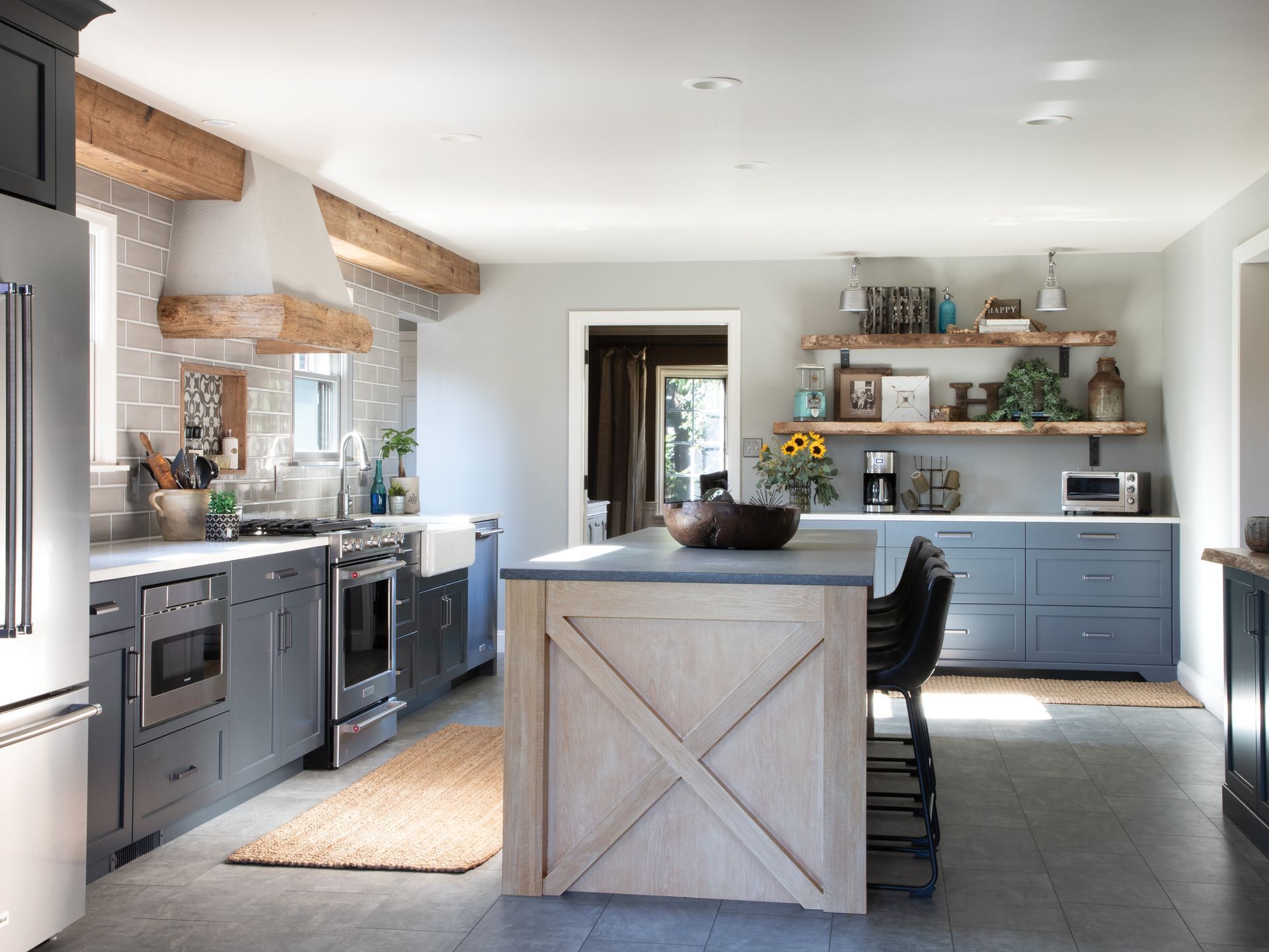 A kitchen with a large island in the middle of it.