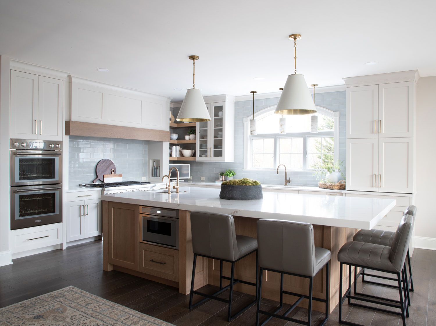There is a large island in the middle of the kitchen.