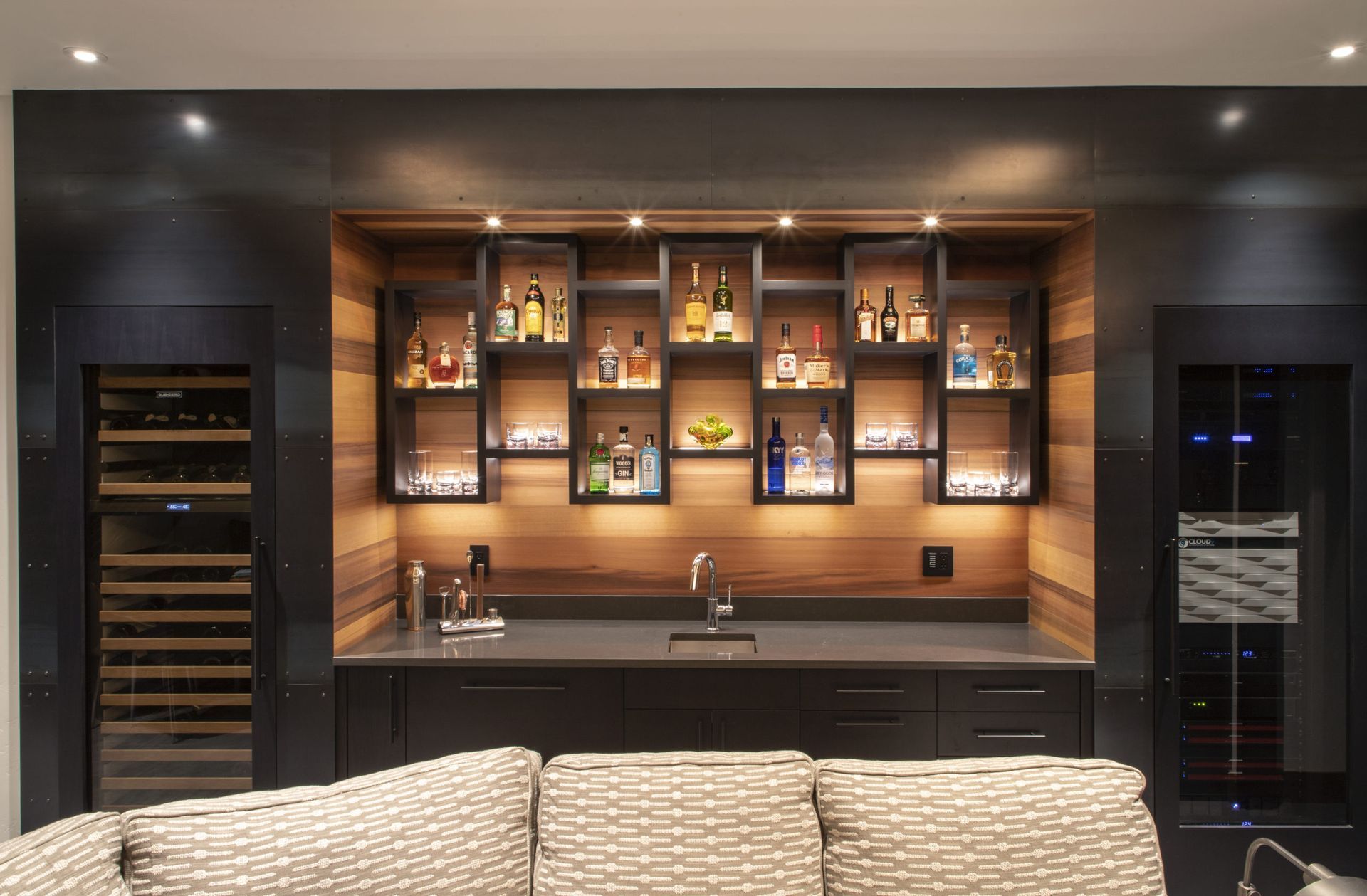 A living room with a bar and a couch