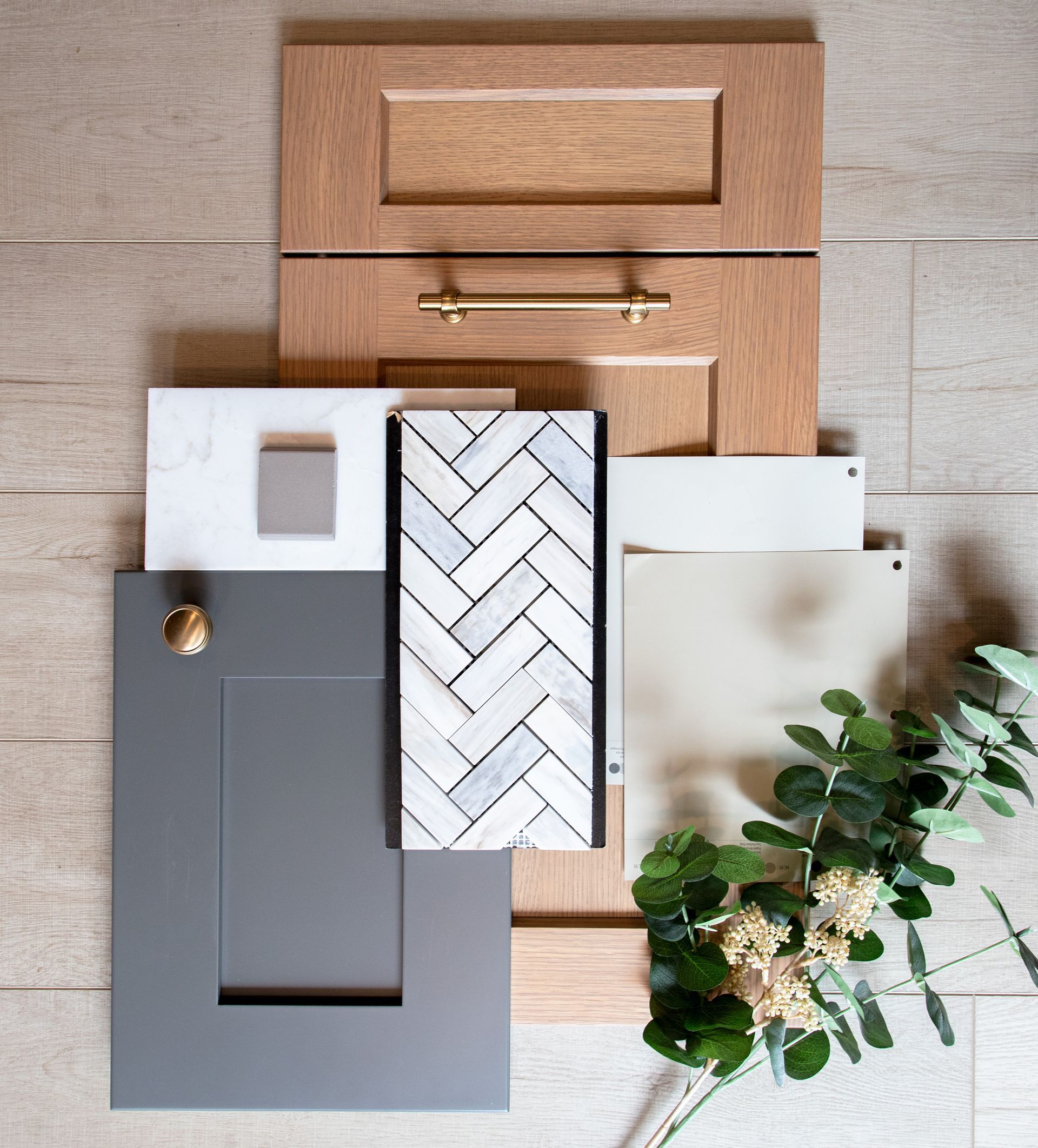 There are many different types of cabinets and tiles on the floor.