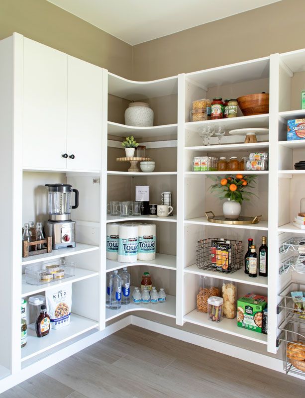 A pantry filled with lots of food and appliances.