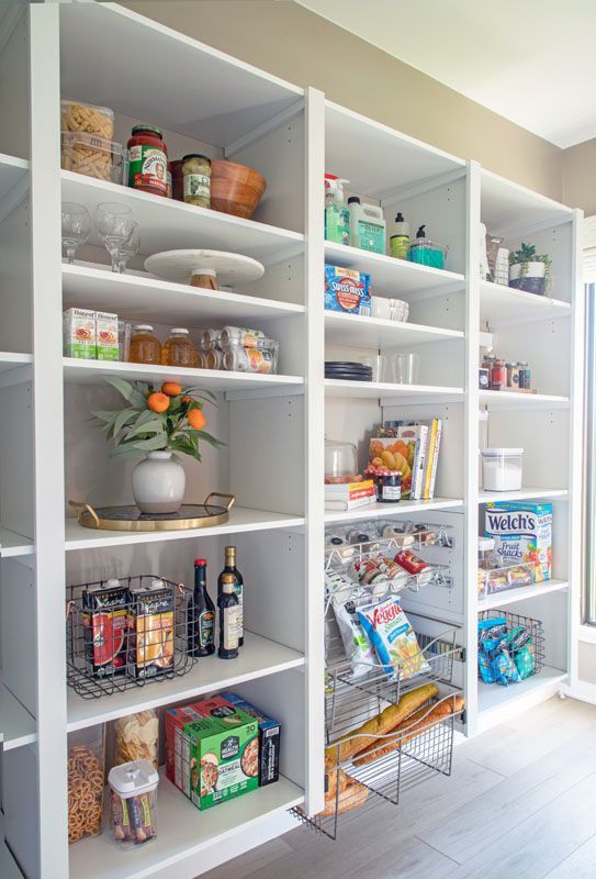 A pantry filled with lots of food and drinks.