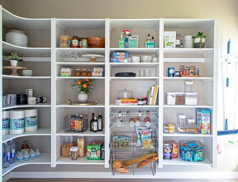 A pantry filled with lots of food and supplies.