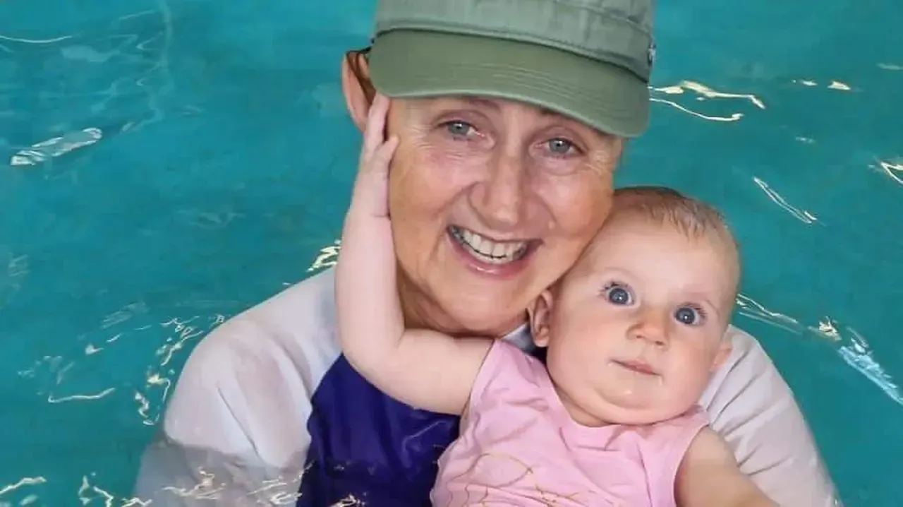 Zaza, Pod Squad’s co-founder, holding her granddaughter Kiara in the warm indoor pool
