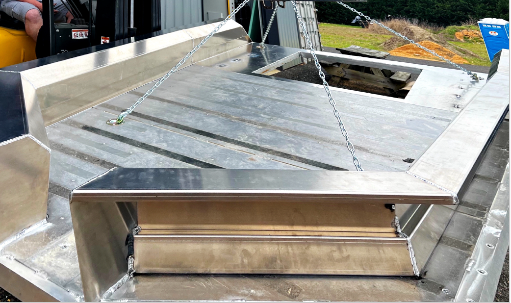 A stainless steel boat being built.