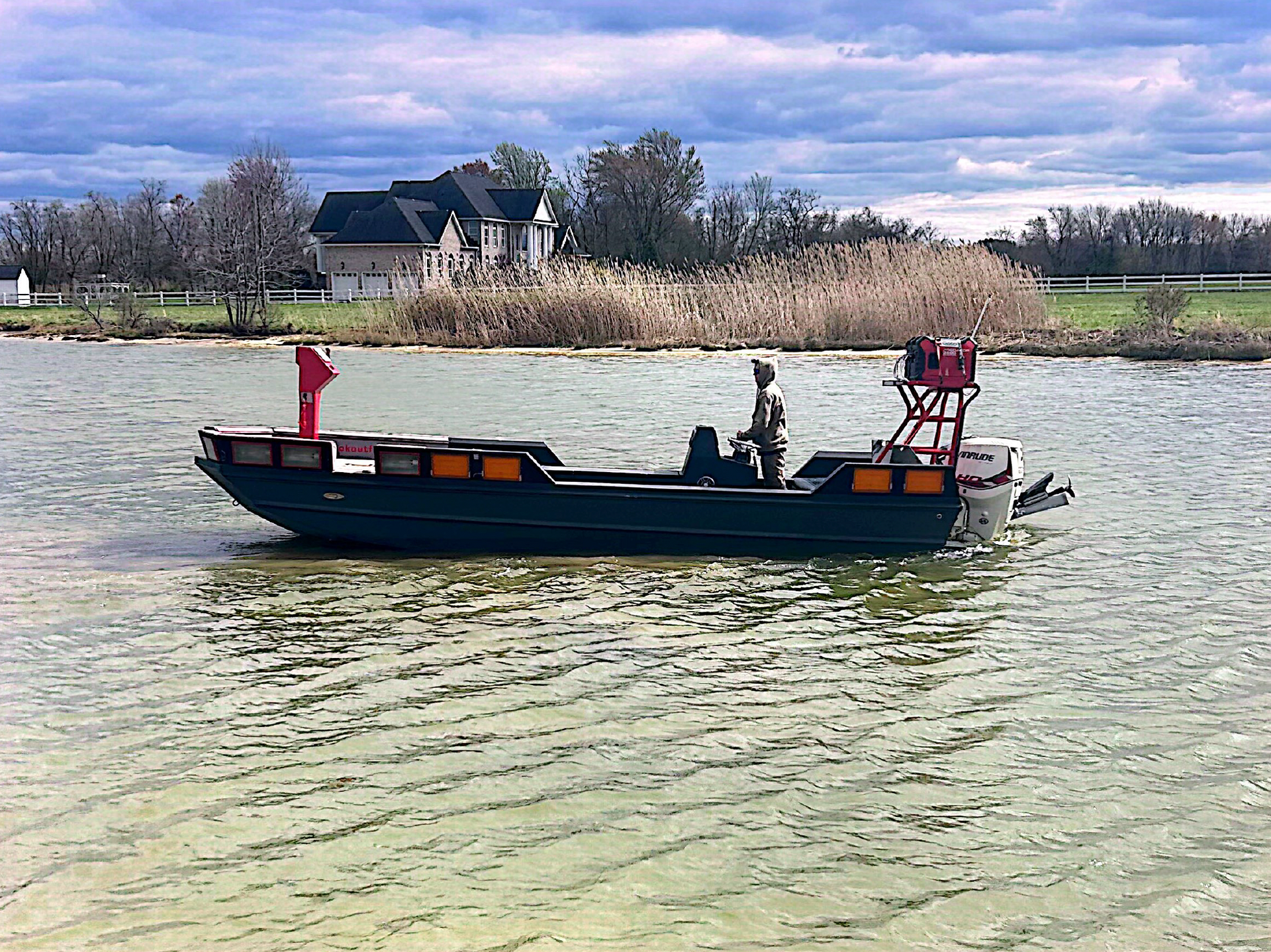 Blake's invader boat on the water.