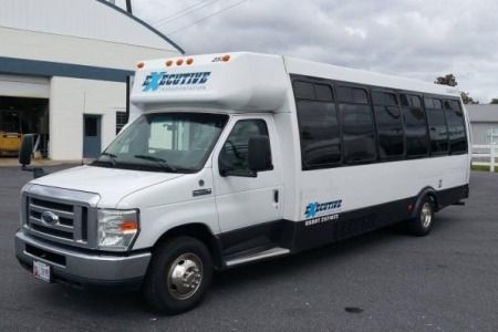 White and black shuttle bus with 