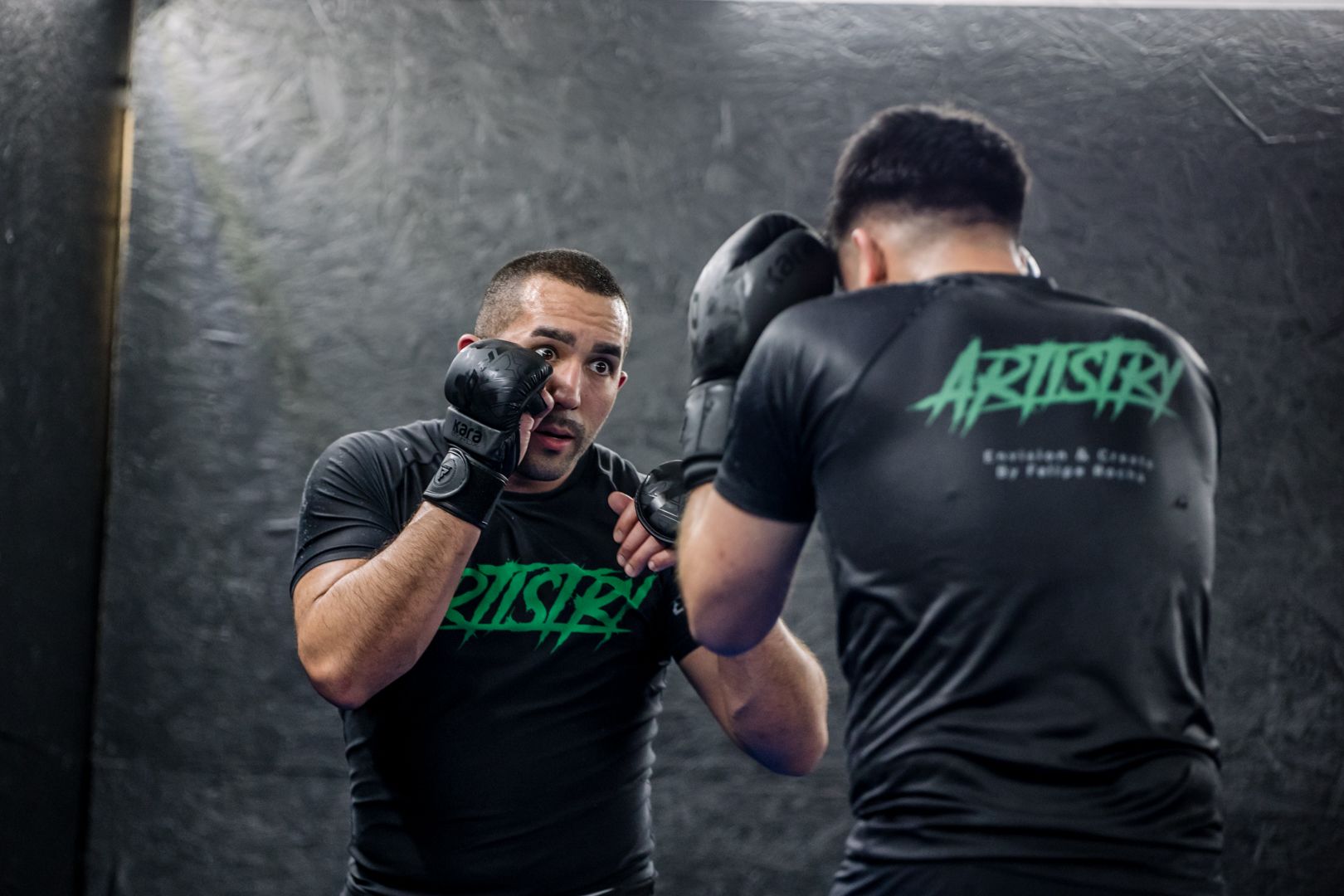 Partners drill Brazilian Jiu Jitsu techniques at Artistry BJJ in Houston, TX, building fitness.