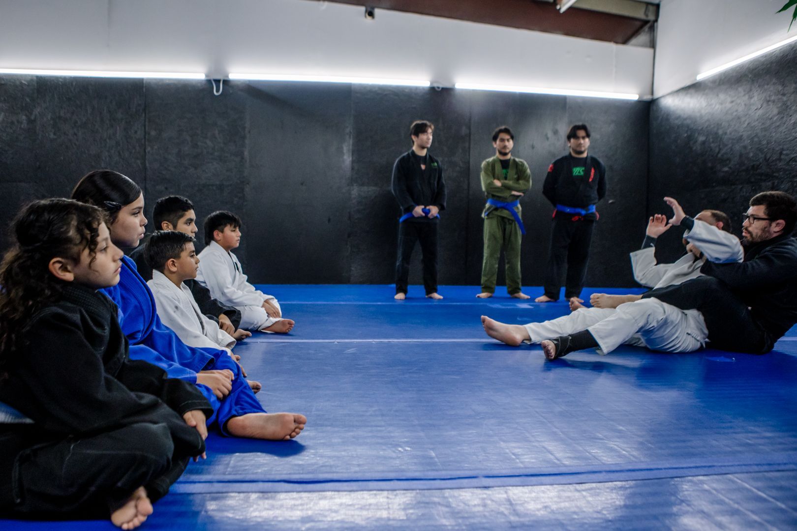 Students practicing Brazilian Jiu Jitsu drills at Artistry BJJ in Houston, TX, building fitness.