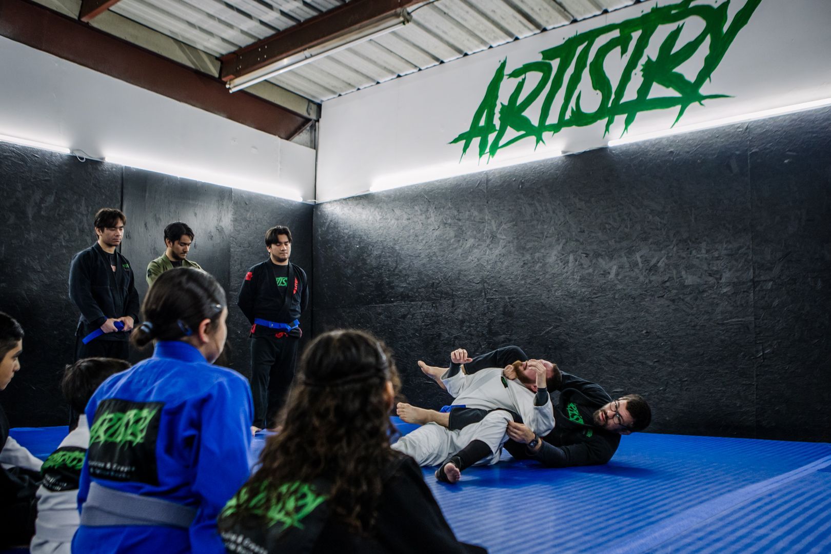 Students practice Brazilian Jiu Jitsu at Artistry BJJ in Houston, TX, building confidence.