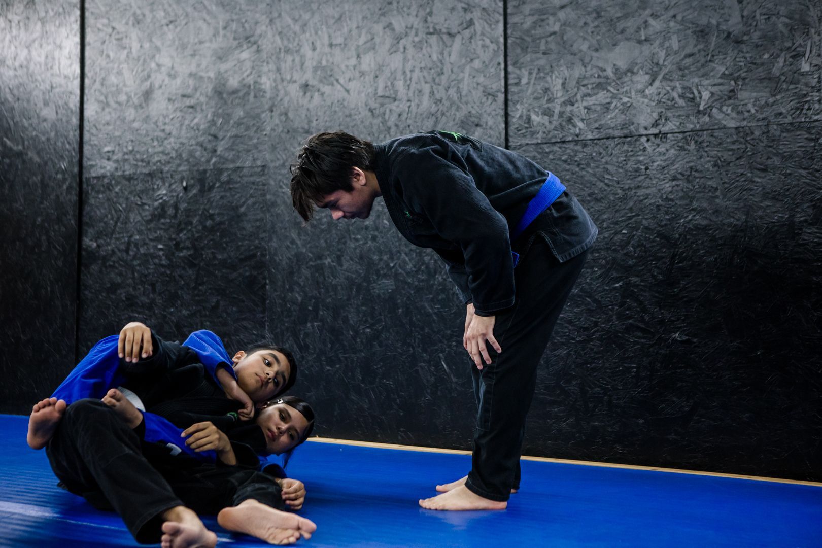 Students drilling controlled self-defense grappling at Artistry BJJ in Houston, TX.