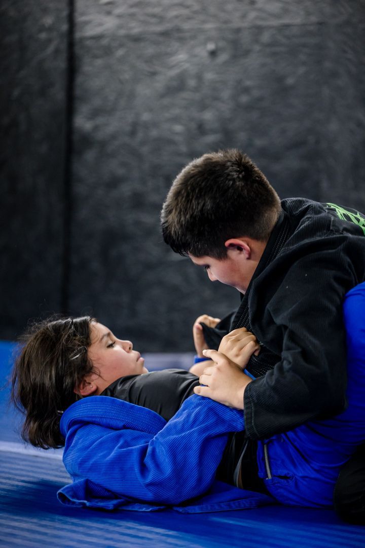 Kids practicing safe grappling drills at Artistry BJJ in Houston, Texas, building confidence and focus.