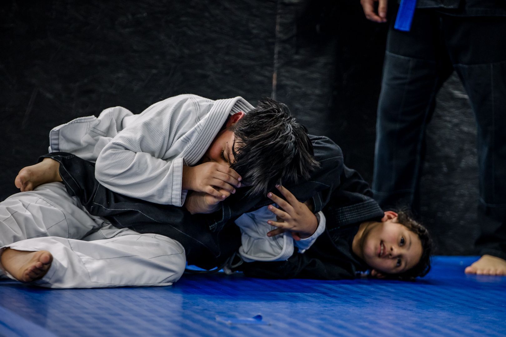 Kids practice safe Brazilian Jiu-Jitsu drills at Artistry BJJ in Houston, Texas, building confidence