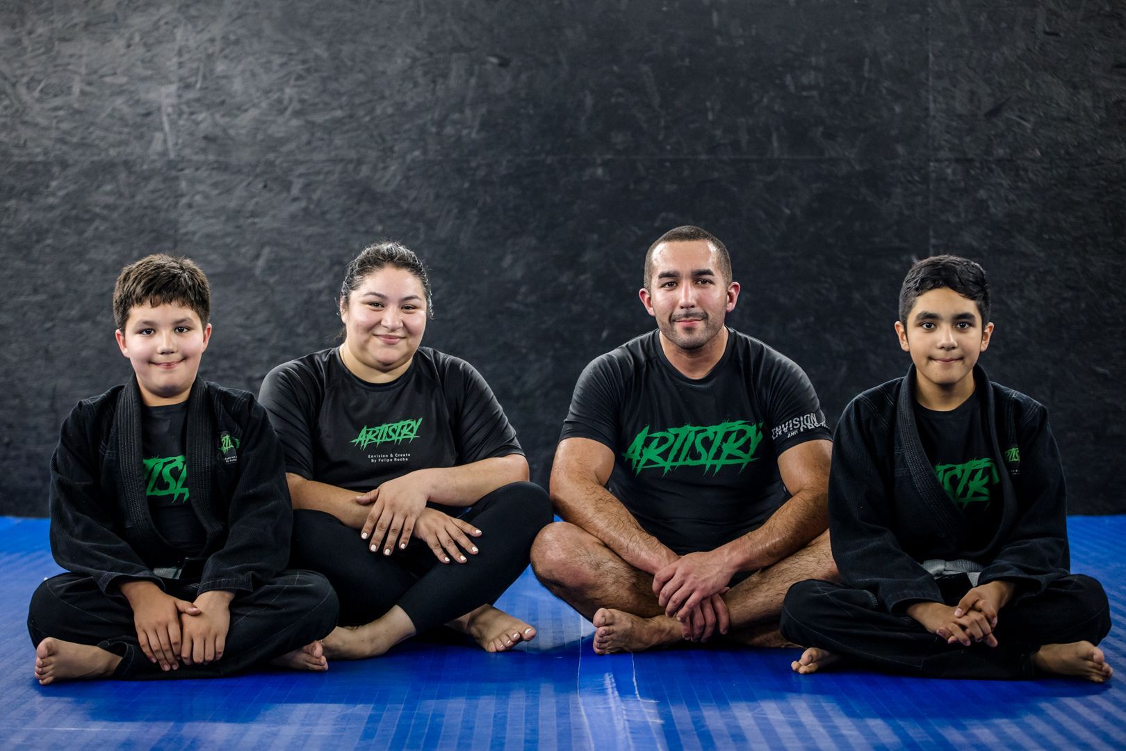 Kids practicing controlled grappling drills at Artistry BJJ in Houston, Texas, building confidence and bully-proof skills.
