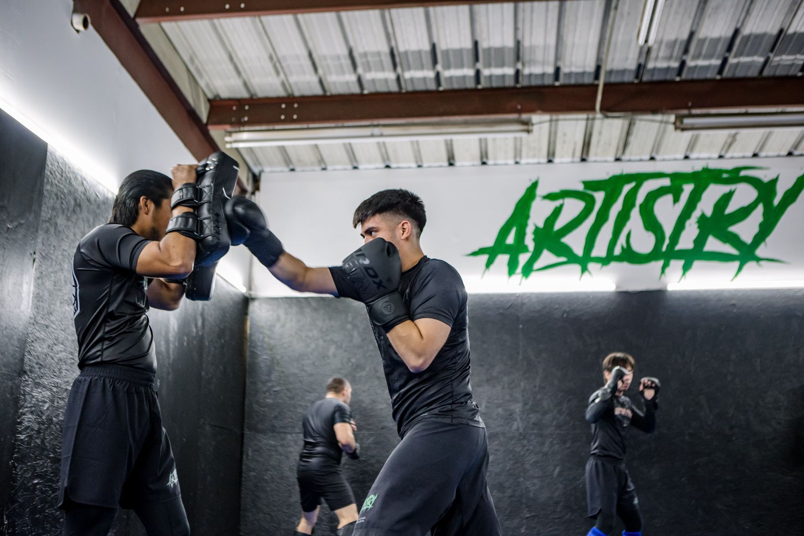 Kids practicing Youth Brazilian Jiu Jitsu at Artistry BJJ in Houston, TX, building confidence.