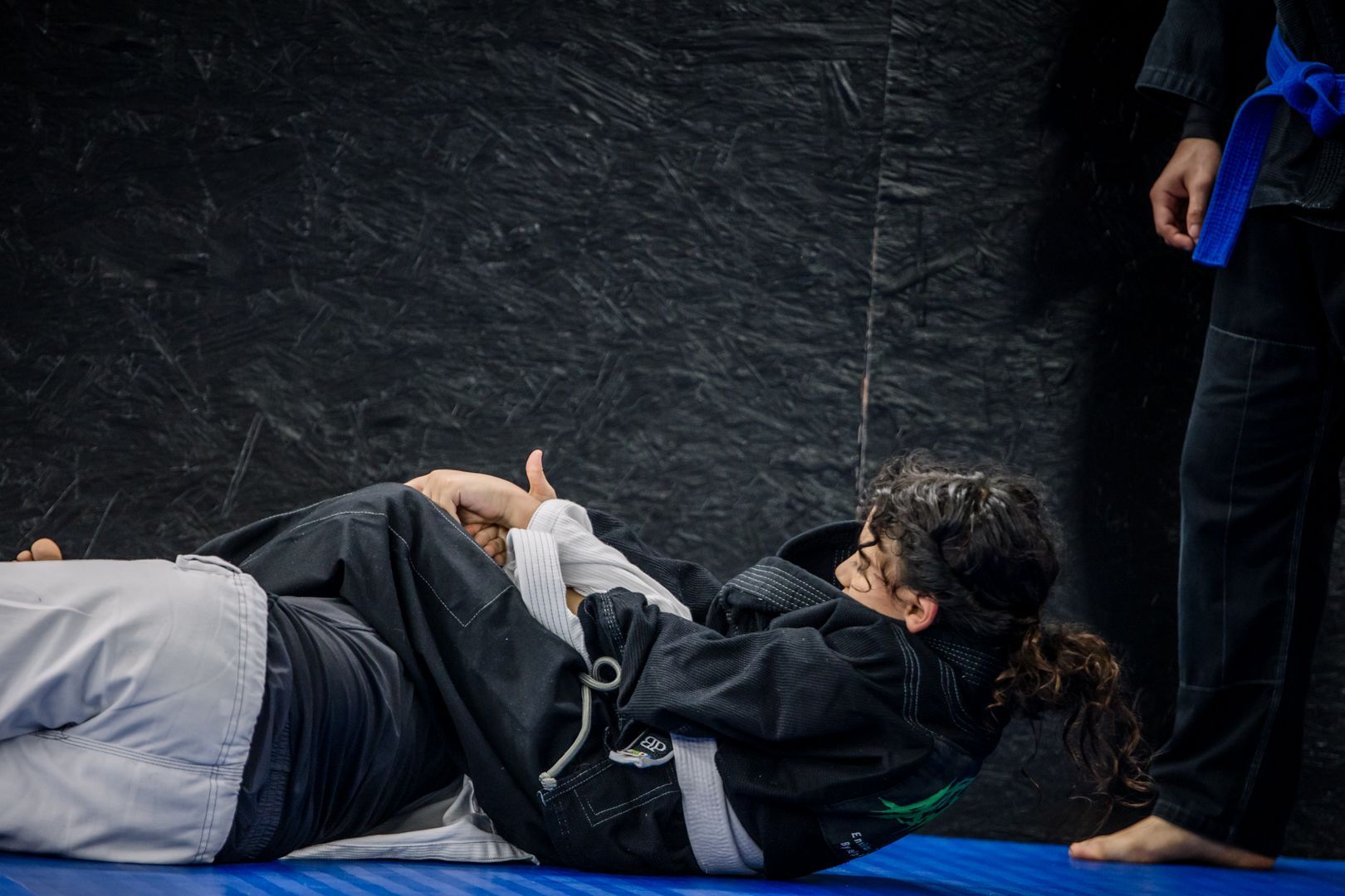 Kids practice controlled grappling drills at Artistry BJJ in Houston, Texas, building confidence.
