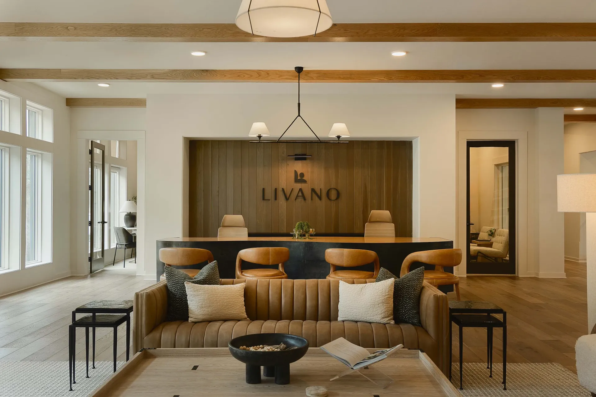 The Livano property's welcoming lobby and reception desk with modern seating and warm wood accents.