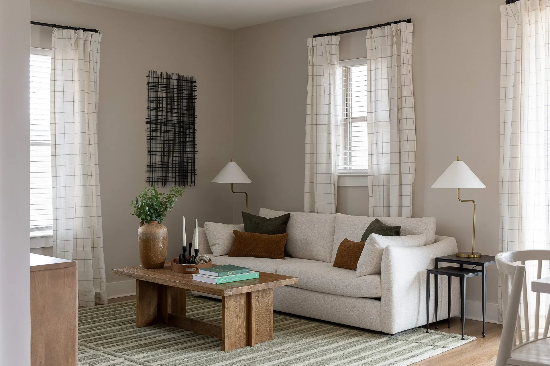 Cozy living room with a light-colored sofa, wooden coffee table, and decorative accents.
